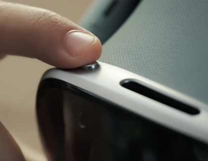 Finger presses the top button on a Galaxy XR headset