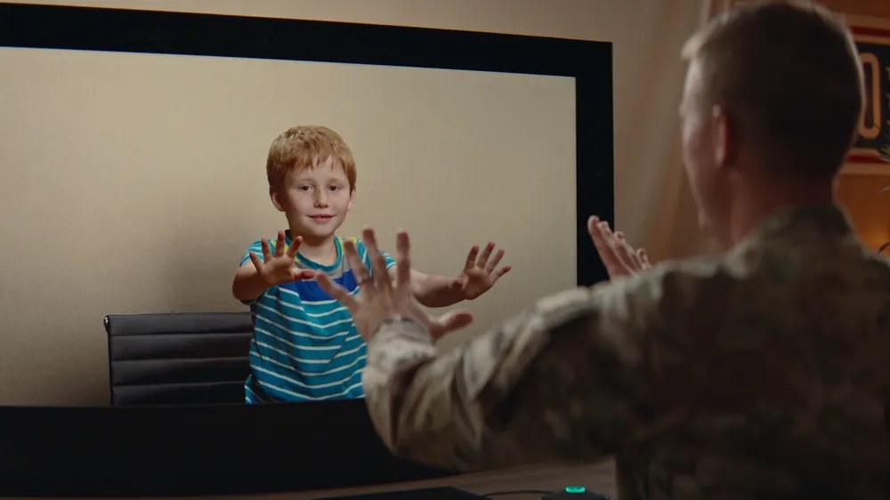 Child greeting a parent through Beam.