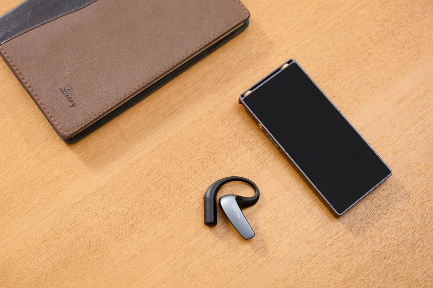 Earbud beside a phone