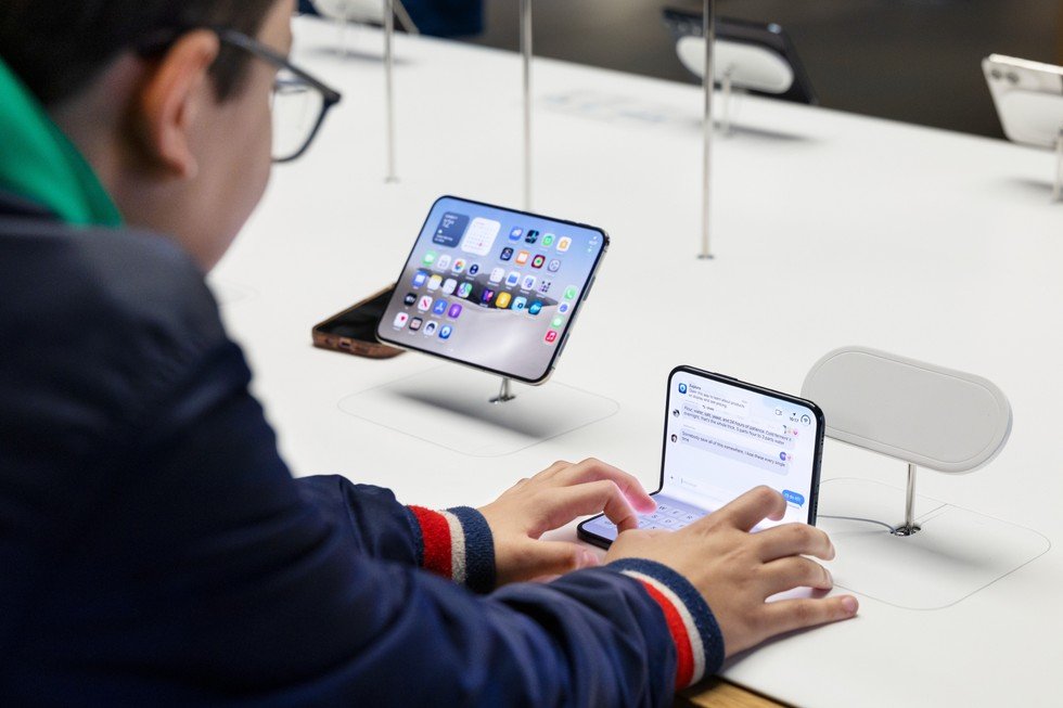 A customer types on an iPhone Duo at Apple Covent Garden.