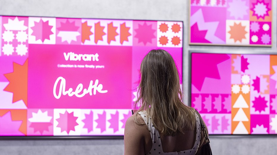 Visitor viewing a colourful Samsung Art TV installation at Art Basel in Basel 2026.