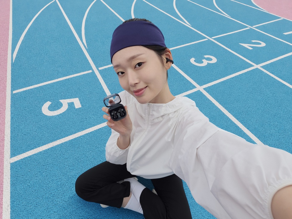 Galaxy Buds On beside a track