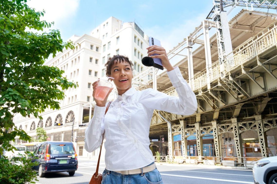 Sony ECM-AX10 microphone attached to a phone used for selfie filming
