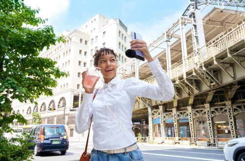 Sony ECM-AX10 microphone attached to a phone used for selfie filming
