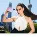 vivo V80 promotional image showing a person holding the purple phone against a city backdrop