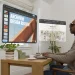 AURA at an office desk